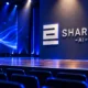 Sharon AI $8.8 billion book Goldman conference